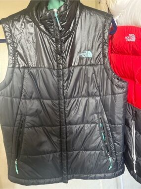 The North Face Black Puffer Vest with Teal Trim - women’s Large